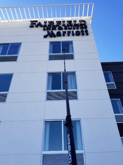 Tall commercial building or hotel facade, clean and reflective
